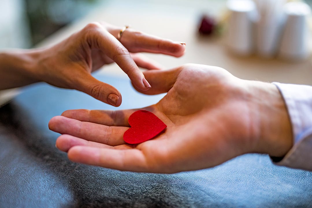 man-giving-red-ornament-heart-woman-1080 man-giving-red-ornament-heart-woman-1080